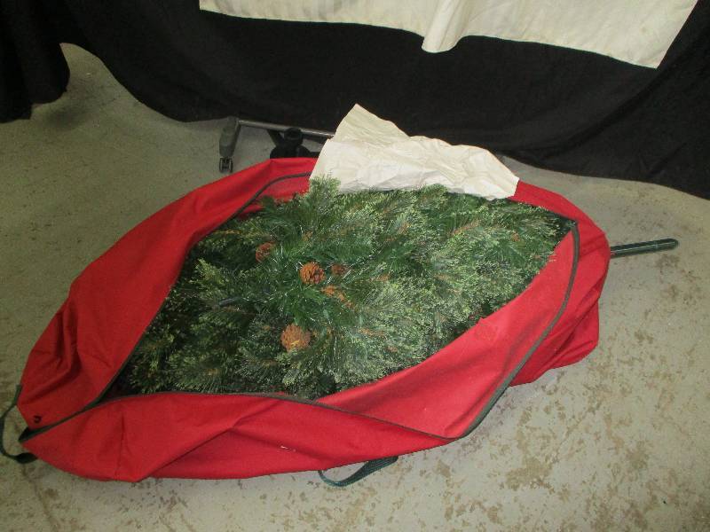 lot 49 image: 6-8 Foot Christmas Tree and 2 Tree Stands and Extra Tree Bad with Wheels