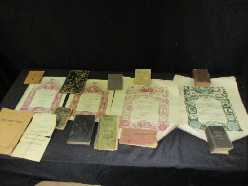 lot 110 image: Old Antique Books in different languages sorry I cant read them But I think she said they were finish n lol then there are which looks like maybe some marriage certificates
