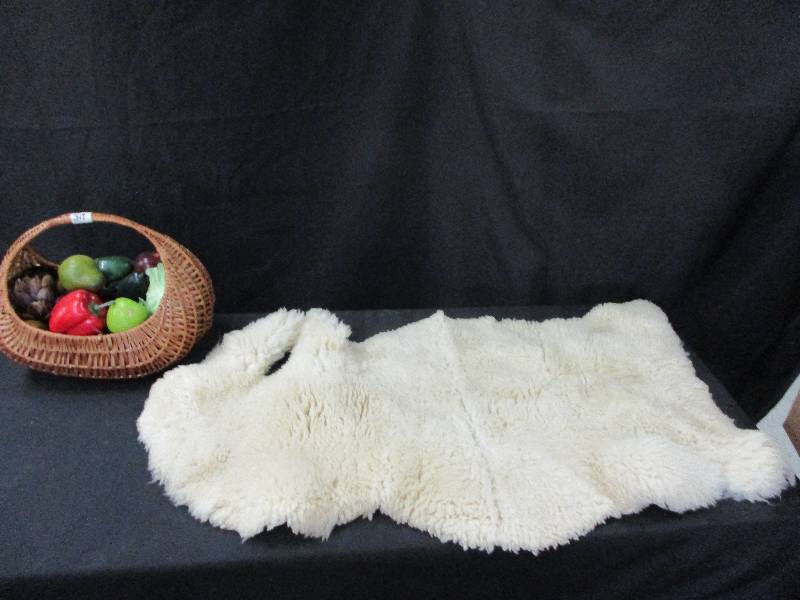 lot 126 image: Wool Sheep Skin and Basket of Fruit