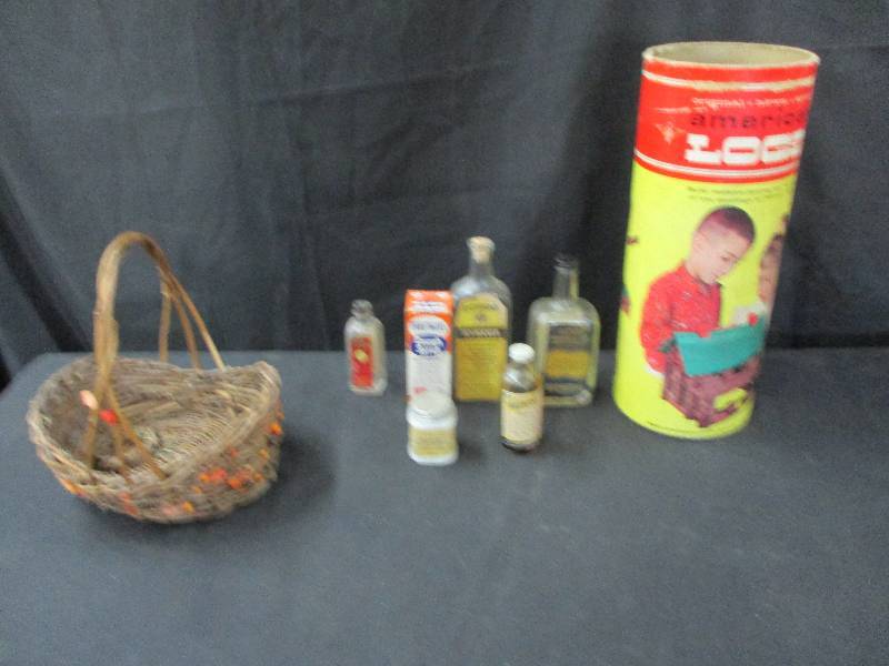lot 132 image: Large Lincoln Log Container empty and Basket of old Bottles
