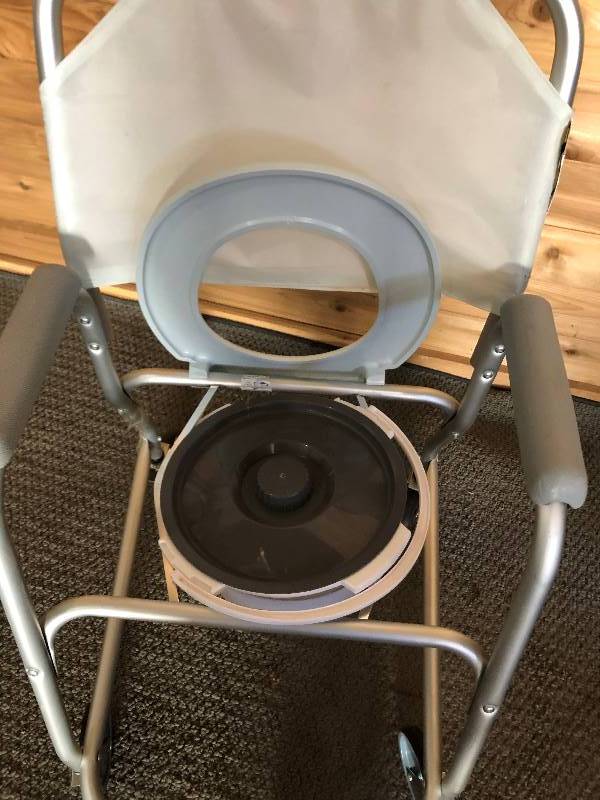 lot 38 image: INVACARE MOBILE SHOWER CHAIRREHAB SHOWER COMMODE CHAIR - REMOVE TOILET BOWL AND THIS WILL CHAIR CAN BACK UP RIGHT OVER THE TOILET - LOOKS NEW