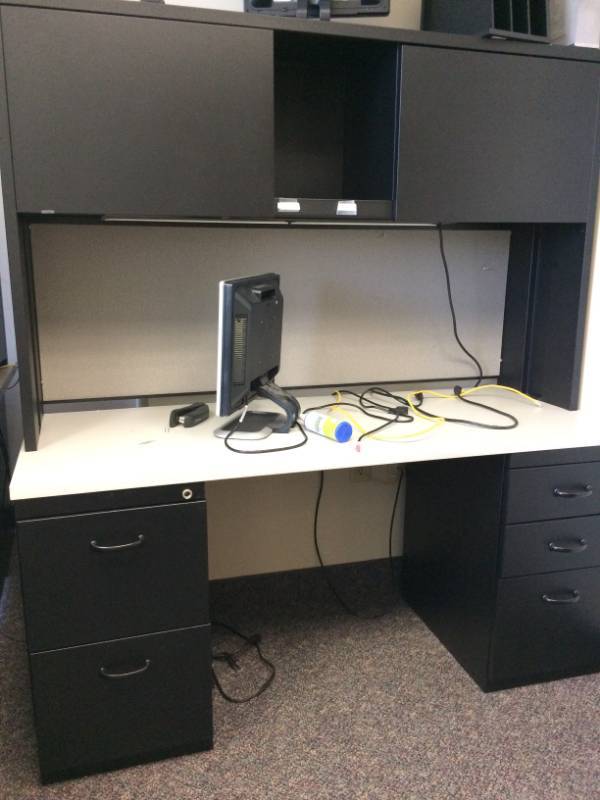 lot 26 image: MSRP $2500 High Quality Steelcase Executive Office Workstation Desk with 1-3 Drawer Filing Cabinet, 1-2 Drawer Filing Cabinet, Lighted Overhead 2 Door Cabinets Sleek Chic BlackWhite Design Excellent Condition 