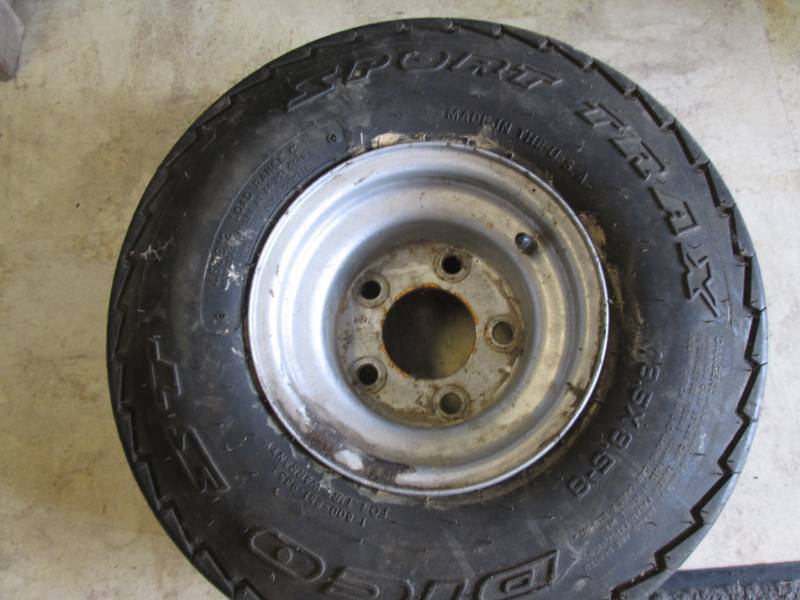 lot 28 image: Sport Trax tire on rim...