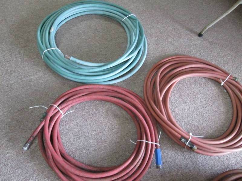 lot 31 image: 3 garden hoses, see pictures for le...