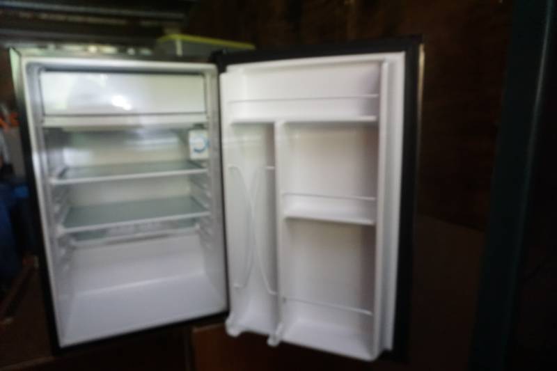 lot 21 image: GE Model GMRO4HANABS Stainless 4.4 Cubic Foot Refrigerator