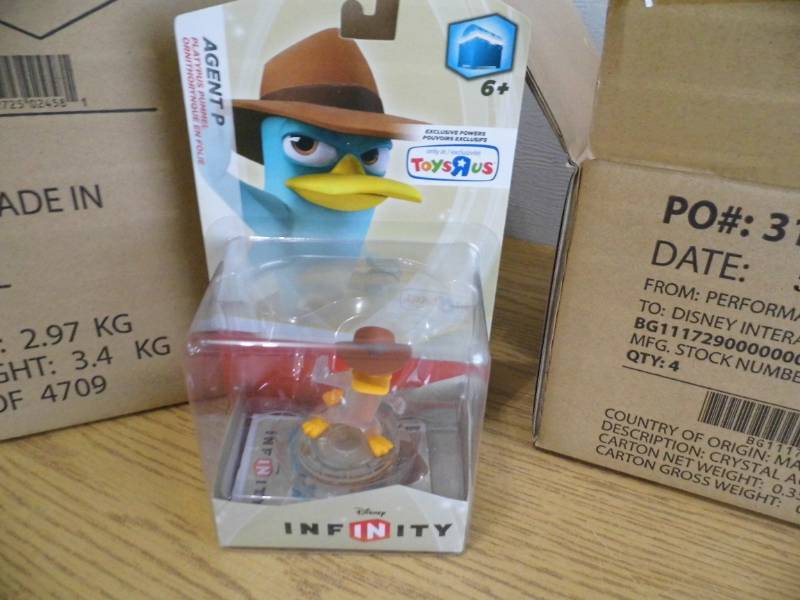 lot 79 image: Case of 24 Disney Agent P Figures