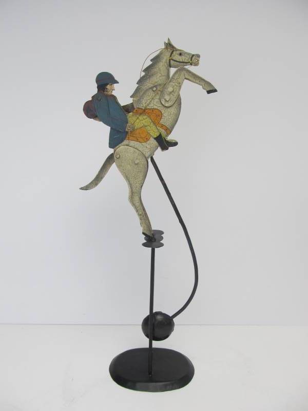 lot 101 image: Painted Metal Balancing Jumping Horse Perpetual Motion Toy