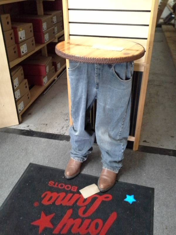 lot 155 image: Cowboy Torso Wood-Top Pedestal Table