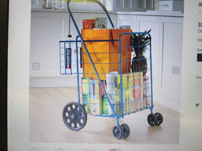 lot 45 image: Shopping Cart with Swivel Wheels an...