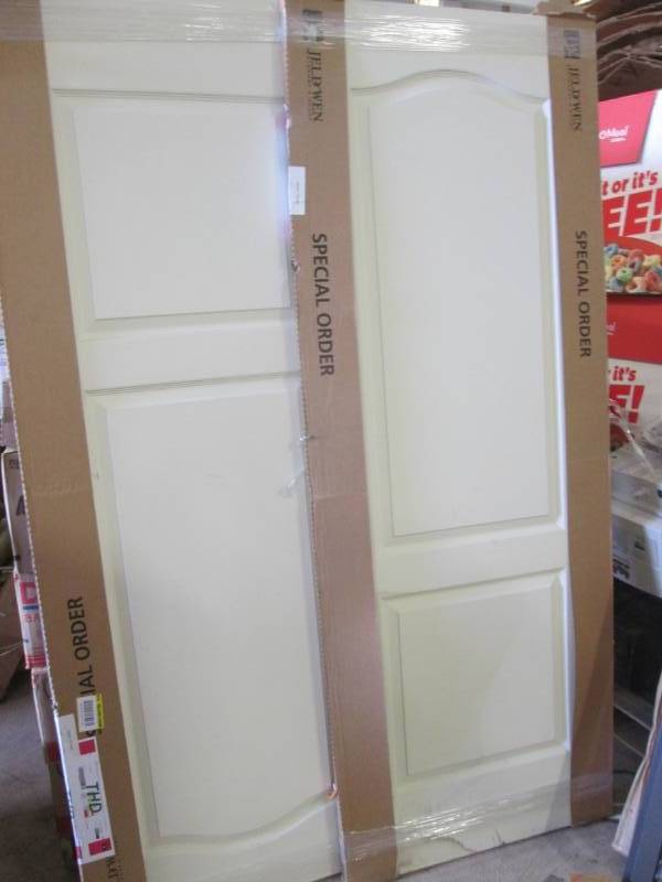 lot 94 image: 2 Jeld Wen Doors 30x80 inch - one h...
