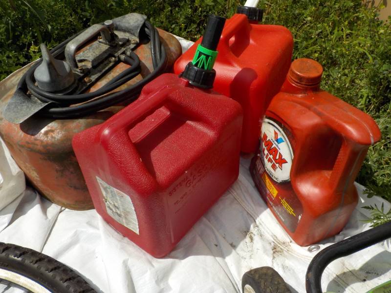lot 73 image: 3 Gas Cans and Valvoline...