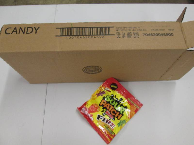 lot 210 image: Case of 12 Sour Patch Fire candy...