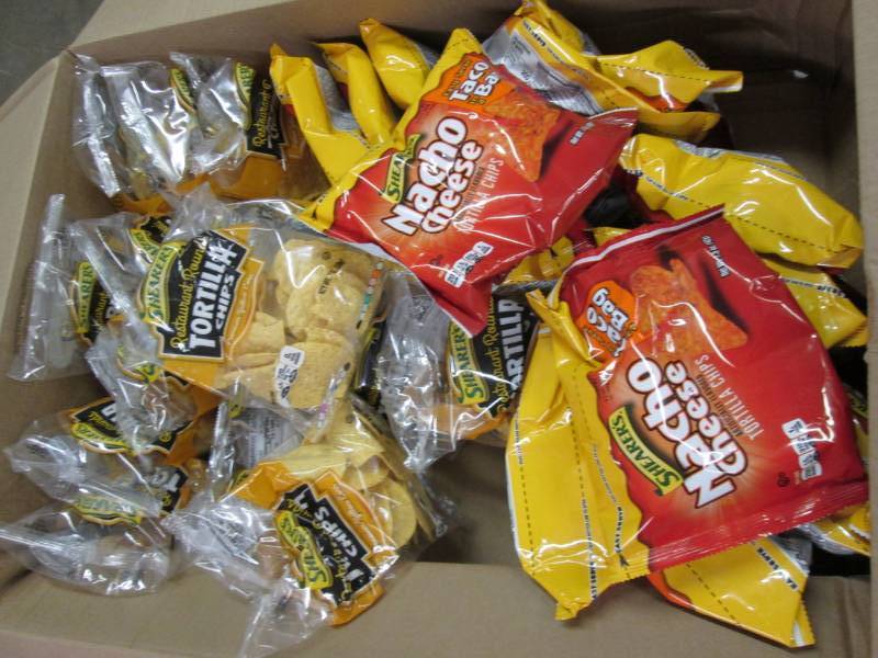 lot 292 image: Box of assorted tortilla chips...