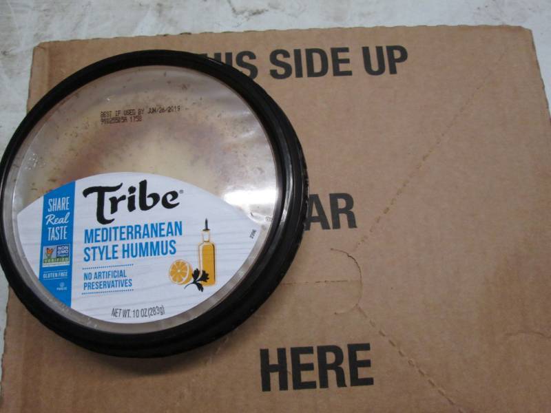 lot 176 image: Tribe Mediteranean Style Hummus case of 12 x 10oz dated June 2019, stored frozen