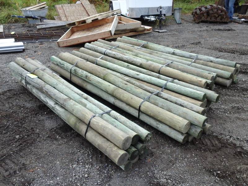 lot 14 image: Lot of (50) 4-5in. Wood Fence Posts