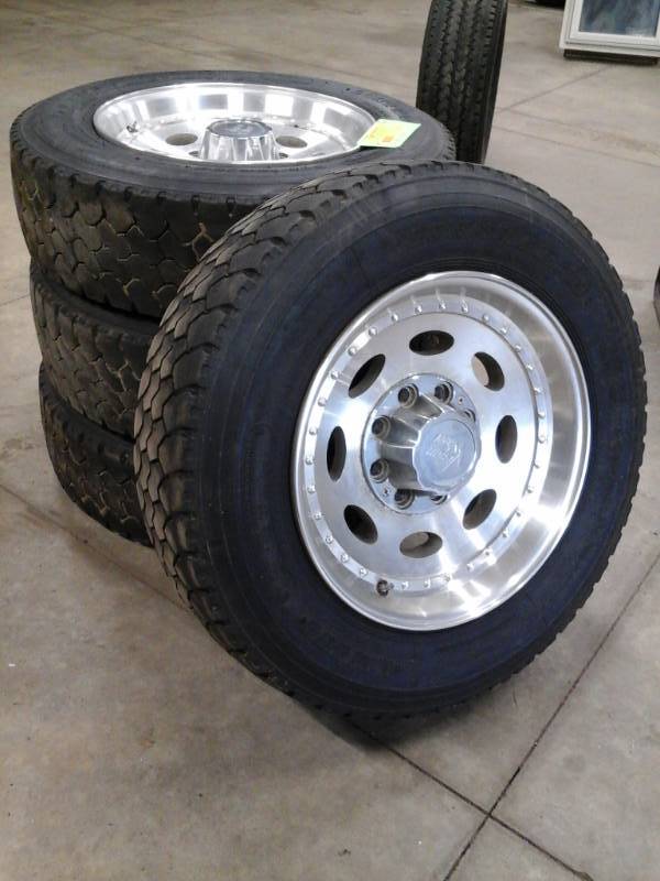 lot 20 image: Lot of (4) Long March LM509 Regroovable 24570R19.5 Tires with Chrome 8-Lug Wheels