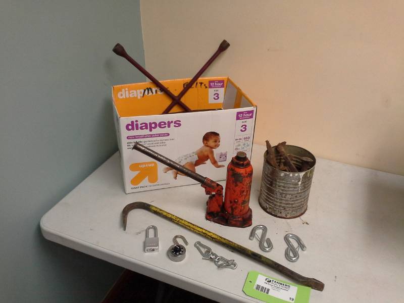 lot 19 image: Tire Iron, Bottle Jack, Pry Bar, S-Clips, Key Padlock, Combination Padlock, Train Rail Spikes, Bungee Cords, Wire Ties
