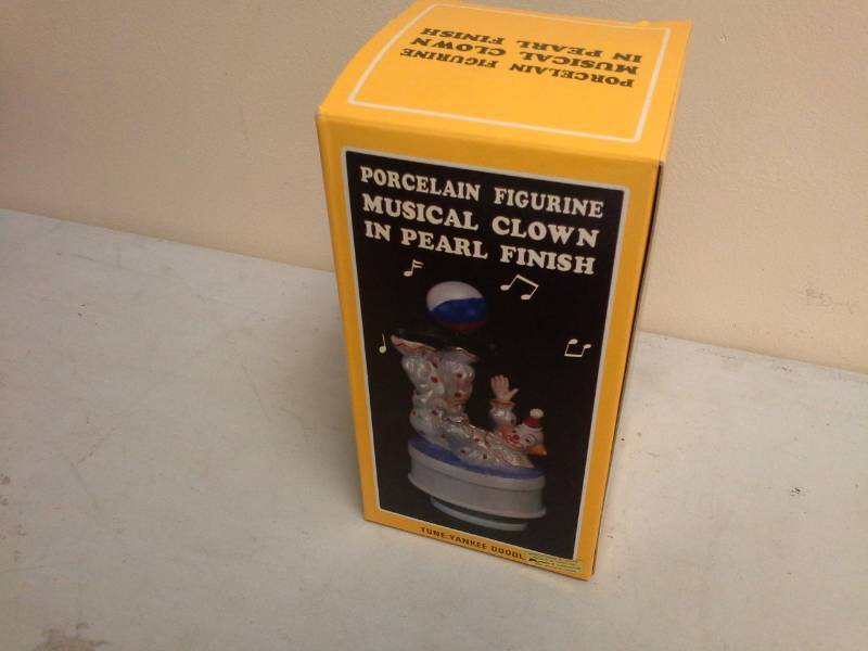 lot 85 image: Porcelain Figurine Musical Clown in Pearl Finish Music Box