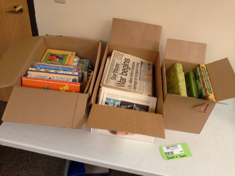 lot 134 image: Moonlanding Newspaper, Childrens Story Books, Merriam-Webster Childrens Dictionary, Vintage Star Tribune Newpapers