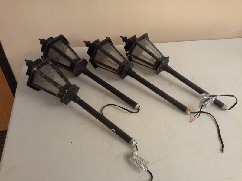 lot 165 image: Lot of (4) Wired Ground Lighting Lamps with Posts