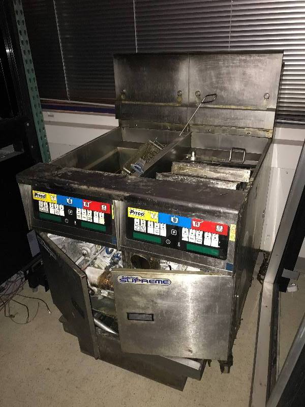 lot 27 image: Pitco, Mod #SSH55, 50 lb. fryers, SN G09EA013152, natural gas, 80,000 BTU, NSF, caster mounted wgrease filter system, complete wAVTEC Chinook stainless steel hood system, Protex II, restaurant fire suppression system