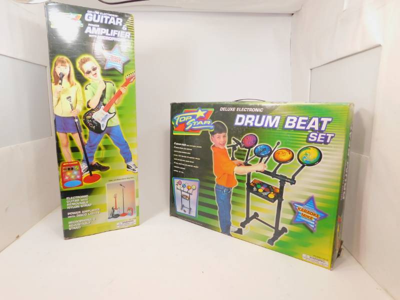 lot 11 image: Appears to Be New Kids Drum Set and Guitar