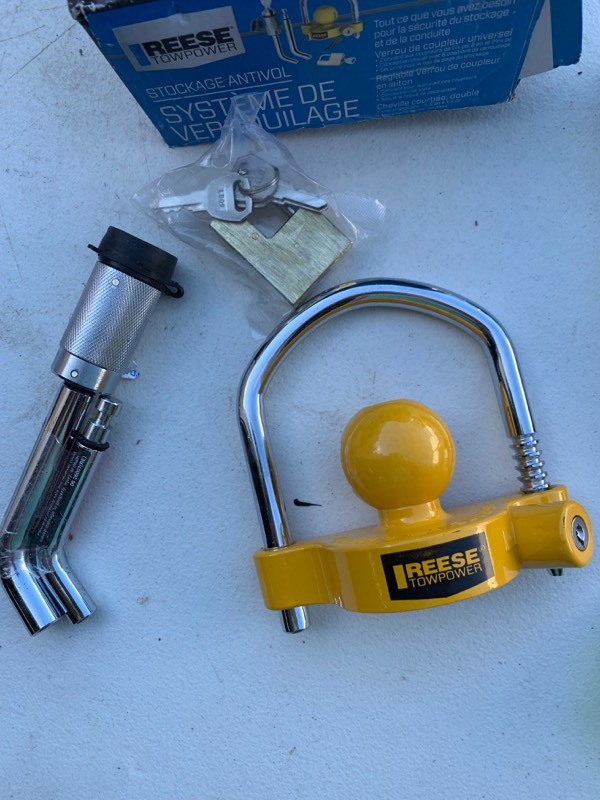 lot 100 image: Reese Towpower Lot- 1 Anti-Theft Lock Kit and 1 Salvage  Stainless Steel Reciever Lock
