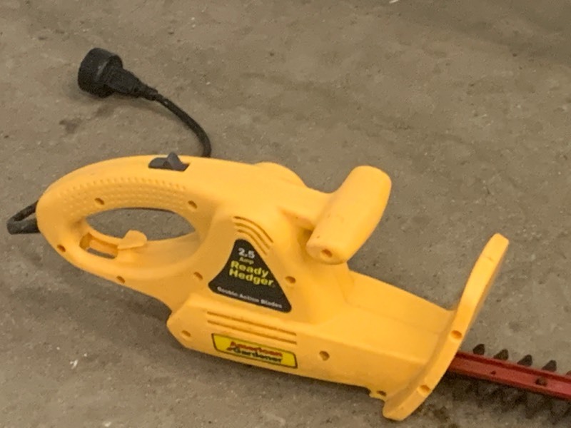 lot 12 image: (1) Fertilizer Spreader & (1) Electric Hedge Trimmer