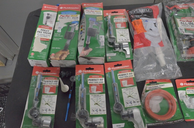 lot 54 image: FluidMaster Lot of Misc. toilet tank levers, toilet fill valves, toilet bowl gaskets, ballcocks.
