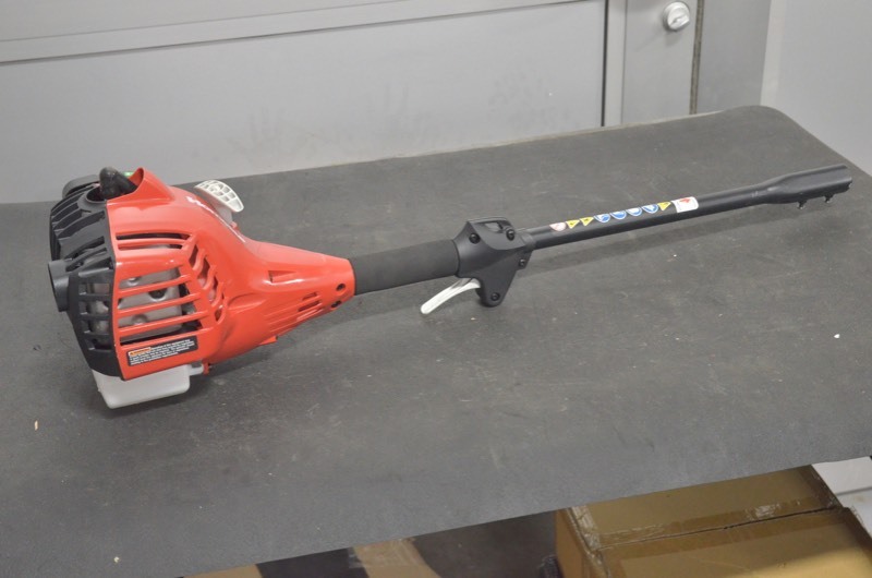 lot 101 image: Homelite UT33650B 26 CC Gas Head with quick change adapter.