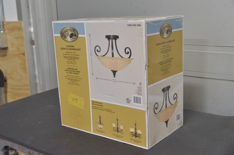 lot 117 image: Carina 16.5 in. 2-Light Aged Bronze Semi-Flush Mount with Glass Shade and Scroll Detail