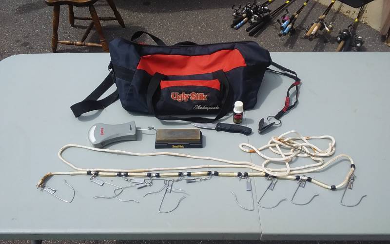 lot 19 image: Shakespeare Ugly Stik Bag With Fishing Accessories Stringer, Knife & Sharpener, Rapala Line Snips & Scale