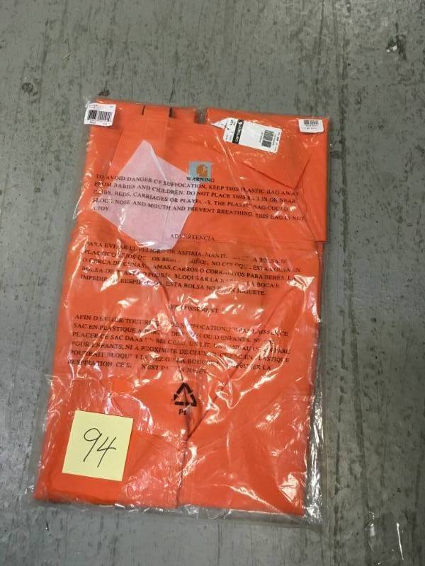 lot 94 image: Carhartt MenS Medium Tall Orange PVCPolyester Surrey Bib Overalls not used