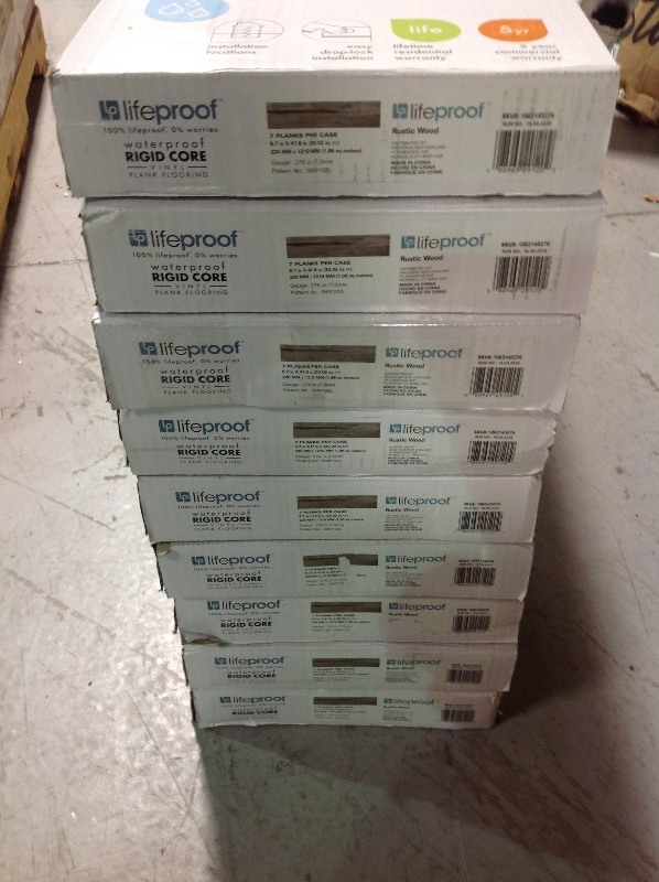 lot 115 image: LifeProof Rustic Wood 8.7 in. x 47.6 in. Luxury Vinyl Plank Flooring (20.06 sq. ft.  case) lot of 9 cases no used