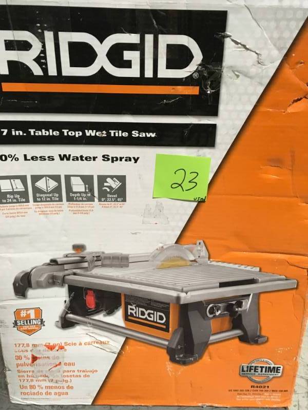 lot 23 image: RIDGID 6.5 Amp Corded 7 in. Table Top Wet Tile Saw in good condition