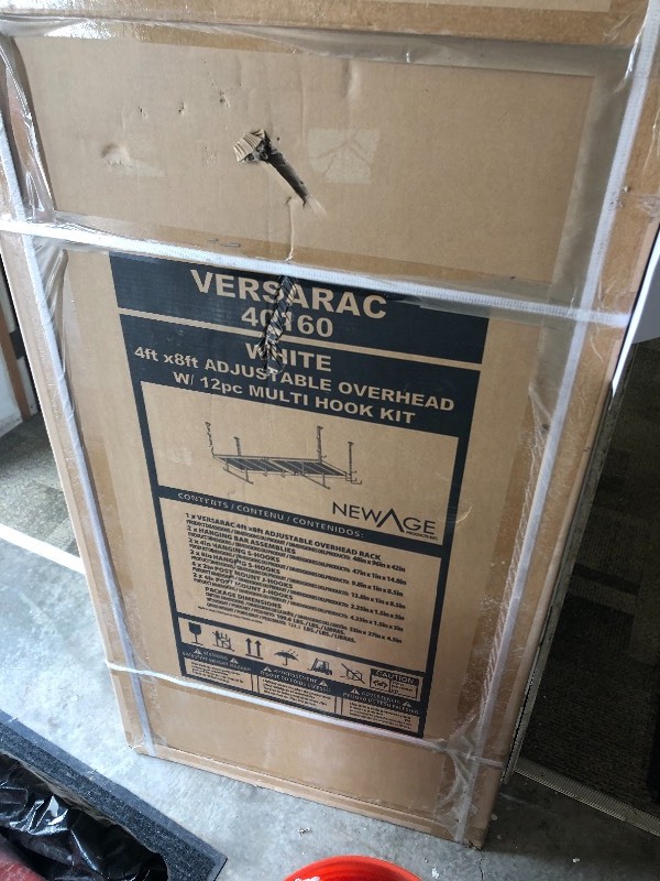 lot 117 image: NewAge Products VersaRac 42 in. H x 48 in. W x 96 in. D Adjustable Height Garage Ceiling Mounted Storage Unit in White w12-Piece Hooks not used