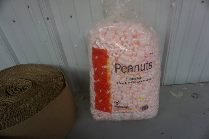 lot 38 image: Bag of Styrofoam Packing Peanuts & Partial Roll of Corrugated Packing Paper