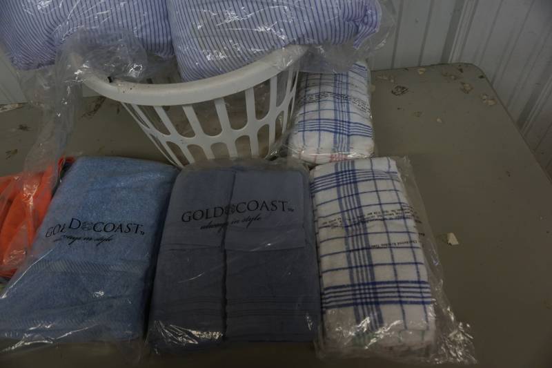 lot 171 image: Plastic Cloths Basket With Hand Towels, Dish Towels, Shop Towels, and Pillows