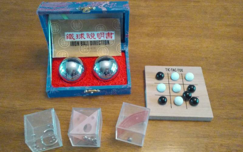 lot 19 image: Chinese Baoding Iron Balls, 3-Brain Teaser Games, Tic Tac Toe Game
