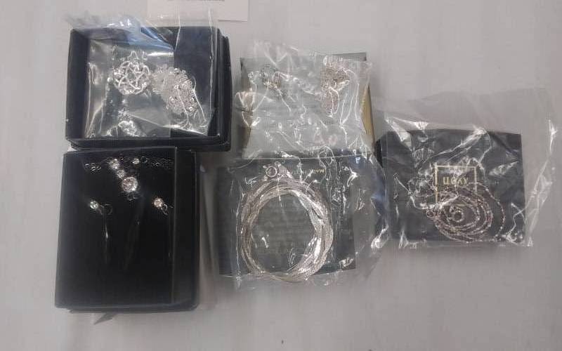 lot 26 image: 4-Silvertone ChainsPendants Unopened & 1-Black Chain Pendant With Matching Pierced Earrings