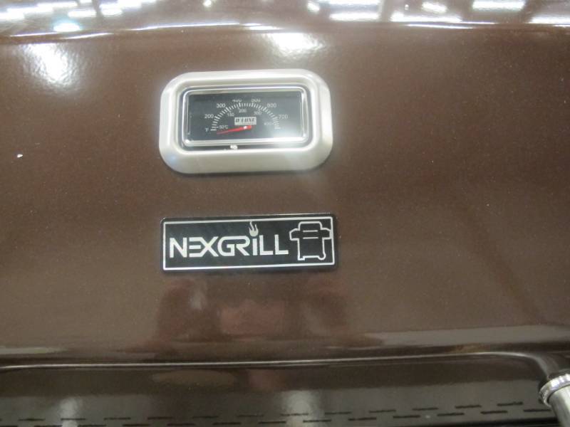 lot 72 image: NEW Nexgrill Deluxe 6-Burner Propane Gas Grill in Mocha with Ceramic Searing Side Burner - Missing Dial  Small Dent