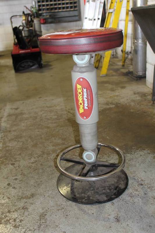 lot 54 image: Monroe Shocks Padded Shock Absorber Stool