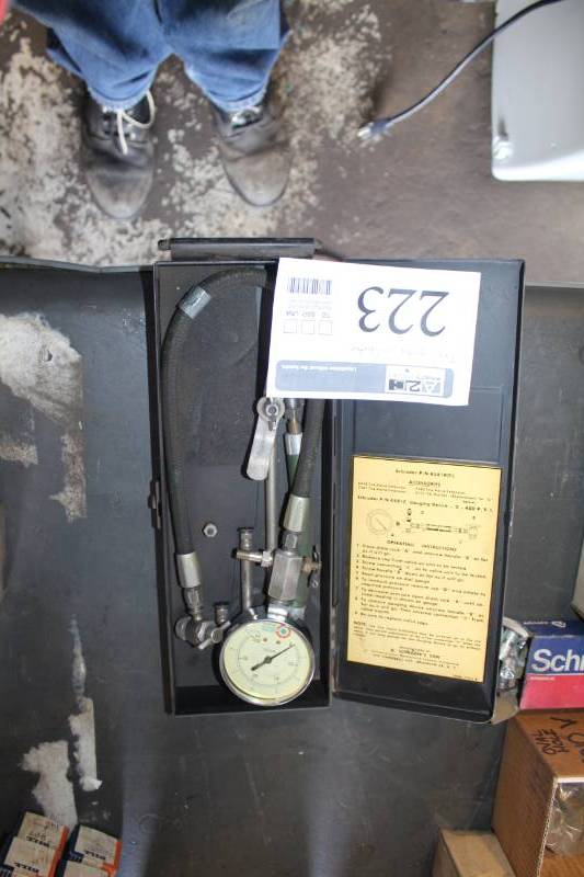lot 223 image: Schrader 4581C Tire Gauge Calibrator with Metal Case