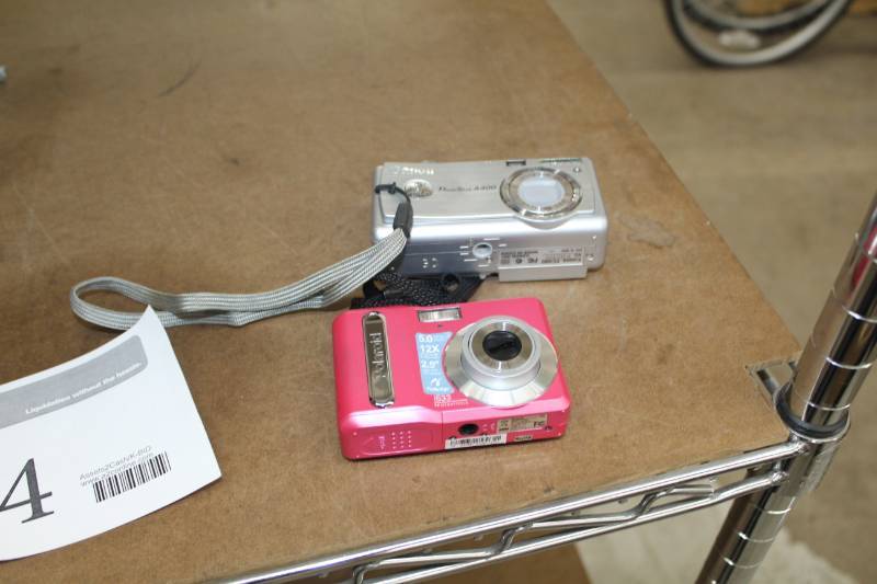 lot 104 image: Lot of (2) Polaroid 5.0 Megapixel i533 Digital Point and Shoot Camera, Canon 3.0 Megapixel PowerShot A400 Diginal Point and Shoot Camera