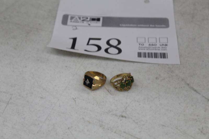 lot 158 image: Lot of (2) Gold Ring with Black Stone, Gold Ring with Green Stones