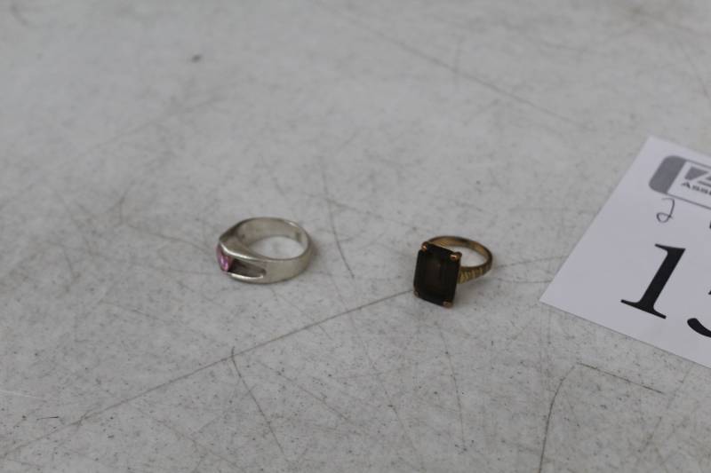 lot 156 image: Lot of (2) Gold Ring with Dark Stone, Silver Rink with Pink Stone