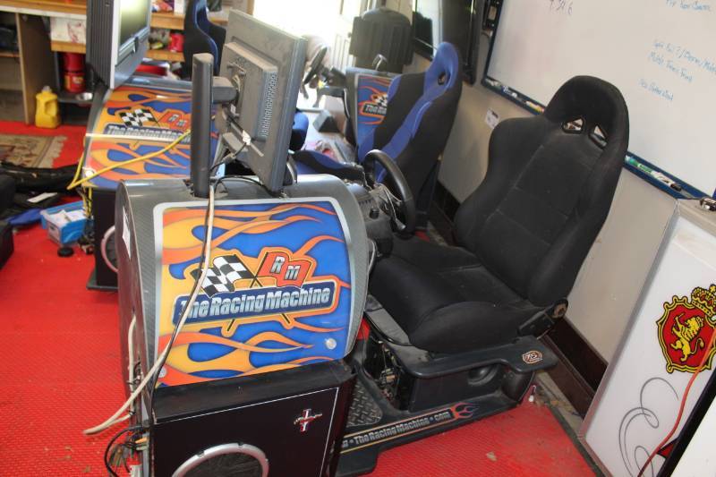 lot 102 image: The Racing Game Seated Video Arcade Game with Racing Seat, Steering Wheel, Display and Stand