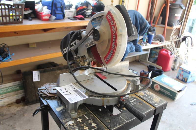 lot 217 image: Delta 10in. Compound Power Miter Table Saw with Rolling Table