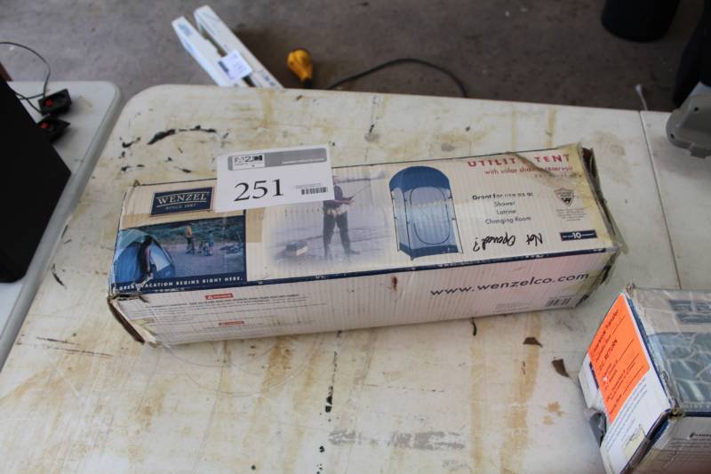 lot 251 image: Utility Tent with Solar Shower Reservoir