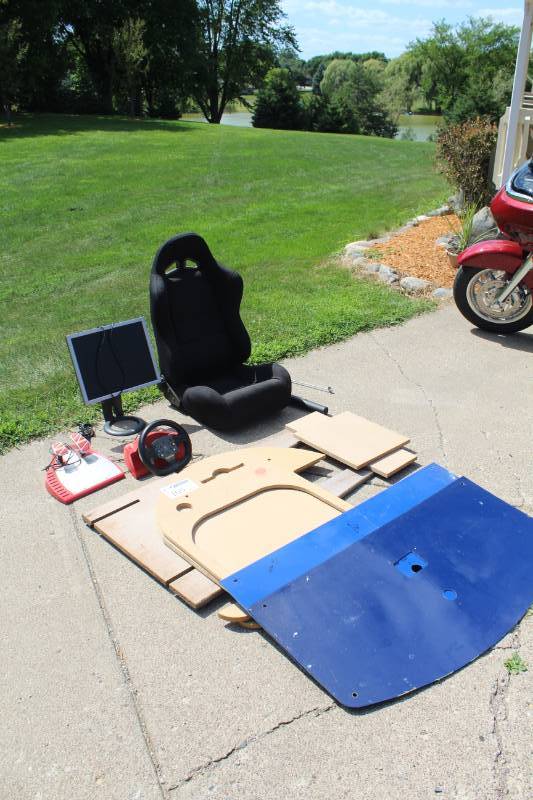 lot 105 image: The Racing Game Seated Video Arcade Game with Racing Seat, Steering Wheel, Display and Stand